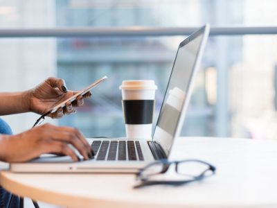 person-using-macbook-air-on-table-1181248